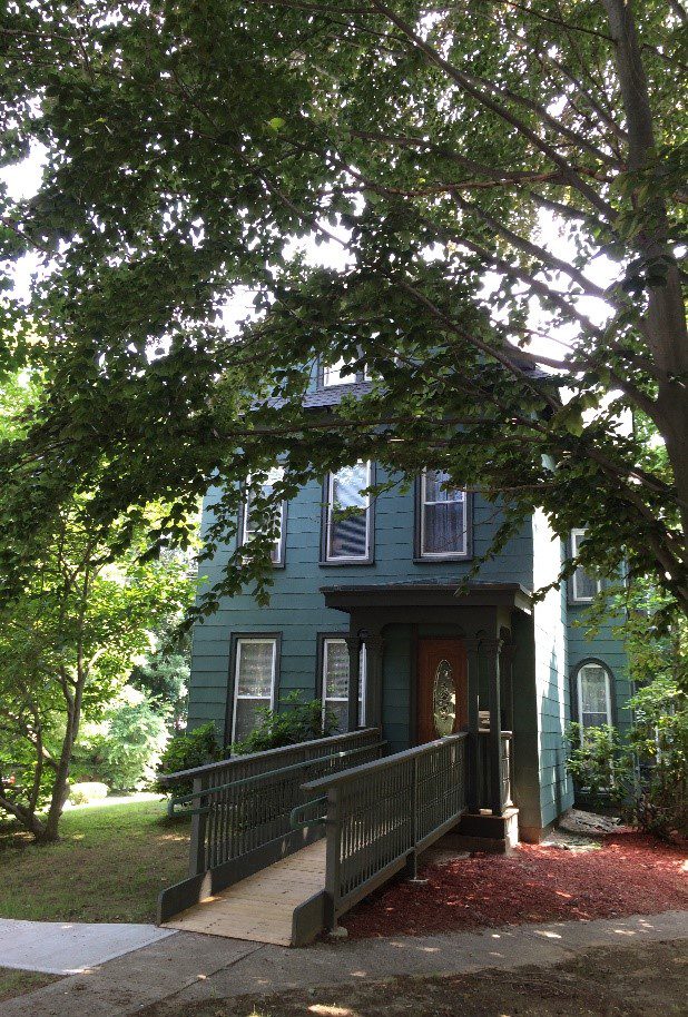 House With Porch And Tree In Front